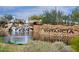 View of the community entrance with a water feature and stone signage reflecting the Vistancia name at 30550 N 125Th Dr, Peoria, AZ 85383