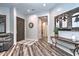 Inviting foyer with wood flooring, neutral paint, console table, and a view into other rooms at 30550 N 125Th Dr, Peoria, AZ 85383