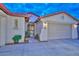 Inviting front entrance with stone pavers, potted plants, security gate, and a covered entry way at 30550 N 125Th Dr, Peoria, AZ 85383