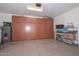 Organized garage with custom storage cabinets at 30550 N 125Th Dr, Peoria, AZ 85383