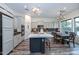 Modern kitchen with a center island, stainless steel appliances and wood floors at 30550 N 125Th Dr, Peoria, AZ 85383