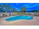 Enjoy this backyard oasis featuring a sparkling pool, rock waterfall, and ample patio space for relaxing or entertaining at 30550 N 125Th Dr, Peoria, AZ 85383