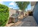 Exterior of home with a grill, landscaping, and a storage shed at 3224 E Sweetwater Ave, Phoenix, AZ 85032
