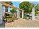 Landscaped backyard boasts a waterfall feature, mature trees, and a seating area at 3224 E Sweetwater Ave, Phoenix, AZ 85032