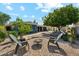 Beautiful backyard with a fire pit, seating, and a hot tub, ideal for relaxation at 3224 E Sweetwater Ave, Phoenix, AZ 85032