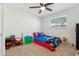 bedroom with ceiling fan, carpet flooring, window, and brightly colored Spider-Personal bedding at 3224 E Sweetwater Ave, Phoenix, AZ 85032