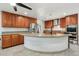 Spacious kitchen with custom wood cabinets, granite countertops, and stainless steel appliances at 3224 E Sweetwater Ave, Phoenix, AZ 85032