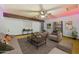 Bright living room featuring plush seating, a ceiling fan, and stylish decor at 3224 E Sweetwater Ave, Phoenix, AZ 85032