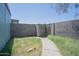 Enclosed backyard with gate access, low maintenance landscaping, and a sense of privacy for outdoor enjoyment at 3646 N 67Th Ave # 12, Phoenix, AZ 85033