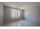 Cozy bedroom with tile flooring and a window that provides natural light at 3646 N 67Th Ave # 12, Phoenix, AZ 85033