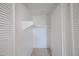 A walk-in closet with white walls, a shelf and a hanging rod at 3646 N 67Th Ave # 12, Phoenix, AZ 85033