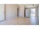 Open living space with tile flooring, plenty of light, and neutral wall color, ready for personalization at 3646 N 67Th Ave # 12, Phoenix, AZ 85033