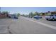 A spacious parking lot offers ample parking with multiple vehicles and greenery, ensuring convenience for residents and visitors at 3646 N 67Th Ave # 12, Phoenix, AZ 85033