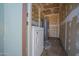 A laundry room includes essential appliances and utility connections in need of remodel for added convenience and efficiency at 3646 N 67Th Ave # 12, Phoenix, AZ 85033