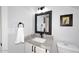 Bathroom with modern sink, granite countertop, and framed mirror at 4338 E Towne Ln, Gilbert, AZ 85234