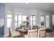 Dining area with round wooden table, stylish chairs, and bright natural light at 4338 E Towne Ln, Gilbert, AZ 85234