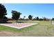 Community playground featuring swings and grassy area, perfect for outdoor recreation and leisure at 4338 E Towne Ln, Gilbert, AZ 85234