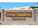 Stone entrance sign for Towne Meadows Estates, showcasing the community's name at 4338 E Towne Ln, Gilbert, AZ 85234