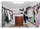 Organized walk-in closet with shelving, drawers, and plenty of space for storage at 4338 E Towne Ln, Gilbert, AZ 85234