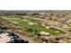 Aerial view of the community golf course, showing green grass, sand traps, and desert landscaping at 5350 E Deer Valley Dr # 1253, Phoenix, AZ 85054