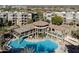 Aerial view of a luxurious community pool and clubhouse with well maintained landscaping at 5350 E Deer Valley Dr # 1253, Phoenix, AZ 85054