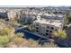 Aerial view of community condos with mature trees and desert landscaping at 5350 E Deer Valley Dr # 1253, Phoenix, AZ 85054