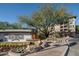 A welcoming entrance sign with flowers and landscaping creates a picturesque arrival at 5350 E Deer Valley Dr # 1253, Phoenix, AZ 85054