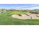 Scenic golf course view with sand traps, putting green, and players enjoying a sunny day on the course at 5350 E Deer Valley Dr # 1253, Phoenix, AZ 85054