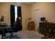 Well-lit bedroom or office featuring neutral walls, dark curtains, a large desk and vintage furniture at 625 W Panola Dr, San Tan Valley, AZ 85140