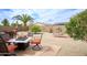 Inviting backyard with a fire pit, lounge chairs, and desert landscaping, perfect for relaxing and entertaining at 6390 S Granite Dr, Chandler, AZ 85249