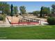 Bocce ball court with benches, umbrellas, and well-maintained surroundings for leisure and outdoor fun at 6390 S Granite Dr, Chandler, AZ 85249