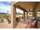 Inviting covered patio features comfortable seating arrangements and an outdoor dining area for entertaining at 6390 S Granite Dr, Chandler, AZ 85249