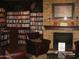 Cozy library featuring bookshelves, a fireplace, and comfortable seating at 6390 S Granite Dr, Chandler, AZ 85249