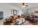 Comfortable living room featuring stylish furnishings, hardwood floors, and a ceiling fan at 6390 S Granite Dr, Chandler, AZ 85249