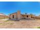 View of the house backyard showcasing the chimney, covered patio, and lots of space at 716 W Nopal Pl, Chandler, AZ 85225