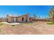 Expansive backyard featuring a covered patio, block fence, and a blank canvas for landscaping at 716 W Nopal Pl, Chandler, AZ 85225