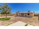 Backyard features a covered patio, block fence, and a blank canvas ready for landscaping at 716 W Nopal Pl, Chandler, AZ 85225