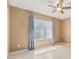 A bedroom featuring a ceiling fan and a window with curtains and blinds to let in natural light at 716 W Nopal Pl, Chandler, AZ 85225