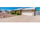 Front of house with a two-car garage and easy to care for rock yard at 716 W Nopal Pl, Chandler, AZ 85225