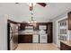 Spacious kitchen features stainless steel appliances and dark wood cabinets at 716 W Nopal Pl, Chandler, AZ 85225