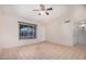 Bright living room with tile flooring, ceiling fan and natural light from window at 716 W Nopal Pl, Chandler, AZ 85225