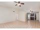 Open living room with ceiling fans and tile flooring leading to other rooms at 716 W Nopal Pl, Chandler, AZ 85225