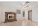 Living room with light colored tile floor, sliding closet doors, and brick fireplace feature at 716 W Nopal Pl, Chandler, AZ 85225