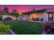 Beautiful backyard with artificial grass, covered patio and seating, perfect for outdoor living at 756 E Appaloosa Rd, Gilbert, AZ 85296