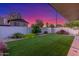 Lush backyard featuring artificial grass, manicured landscaping, and a peaceful setting at 756 E Appaloosa Rd, Gilbert, AZ 85296