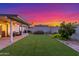 This home's backyard has a lawn, patio, and privacy fencing at 756 E Appaloosa Rd, Gilbert, AZ 85296