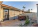 This backyard features a hot tub and a block fence for privacy at 756 E Appaloosa Rd, Gilbert, AZ 85296