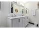 Bathroom featuring double sinks with marble countertops and modern fixtures at 756 E Appaloosa Rd, Gilbert, AZ 85296
