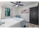 Bedroom featuring a bed, curtains, and dark wood door at 756 E Appaloosa Rd, Gilbert, AZ 85296