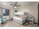Bedroom featuring a bunk bed with pastel colored curtains and a teal chair at 756 E Appaloosa Rd, Gilbert, AZ 85296